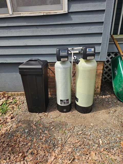 Exterior softener + carbon install against the foundation